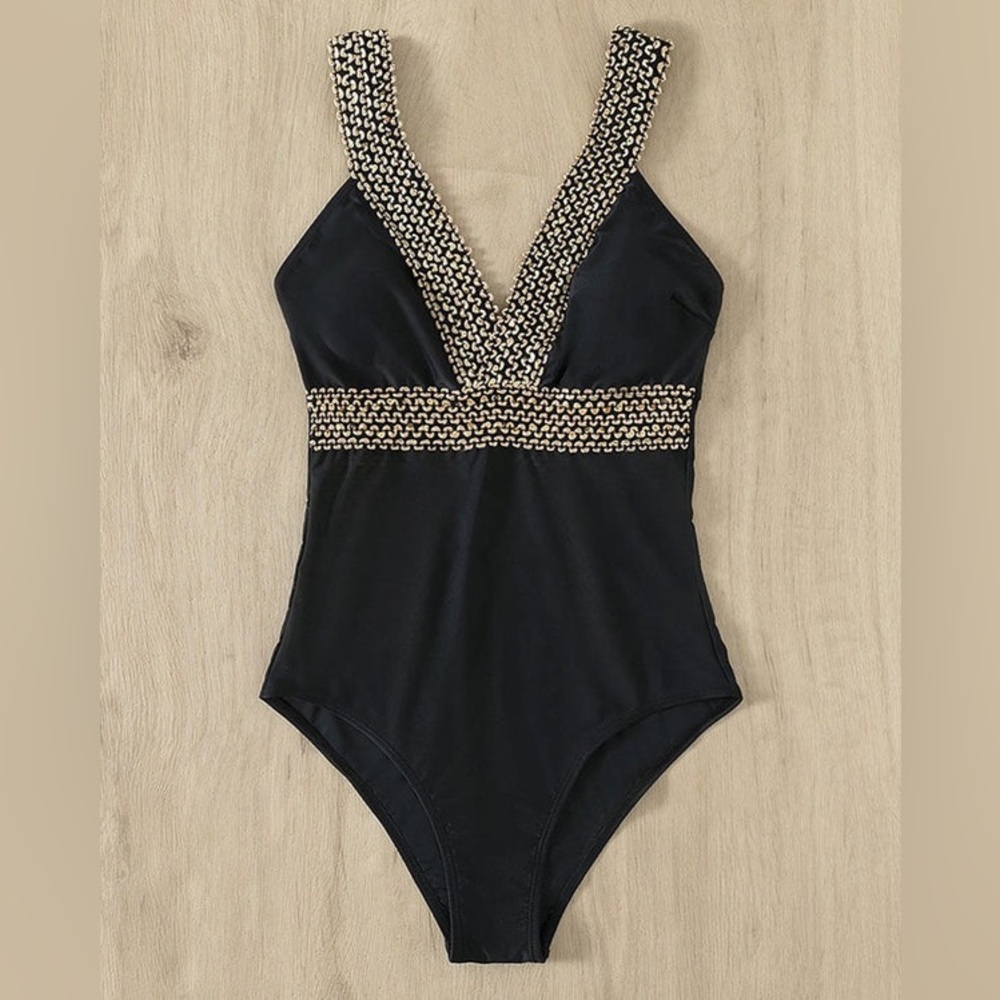 Elegant One piece v-neck low back bathing suit in black. Size XL.